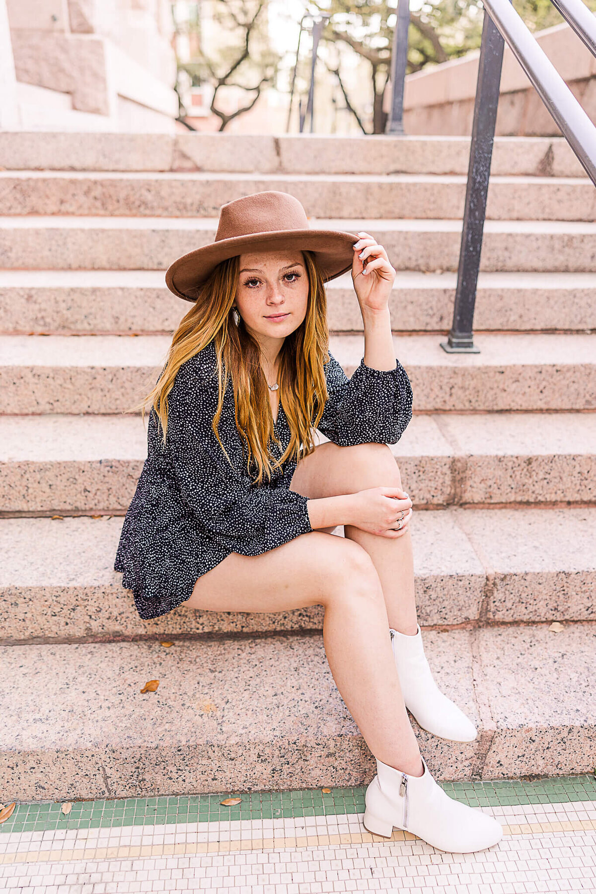 Senior wearing hat on steps