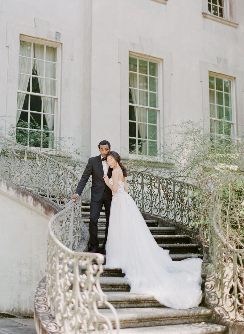 Bride and Groom Hugging on Steps of Swan House in Atlanta Georgia Photo