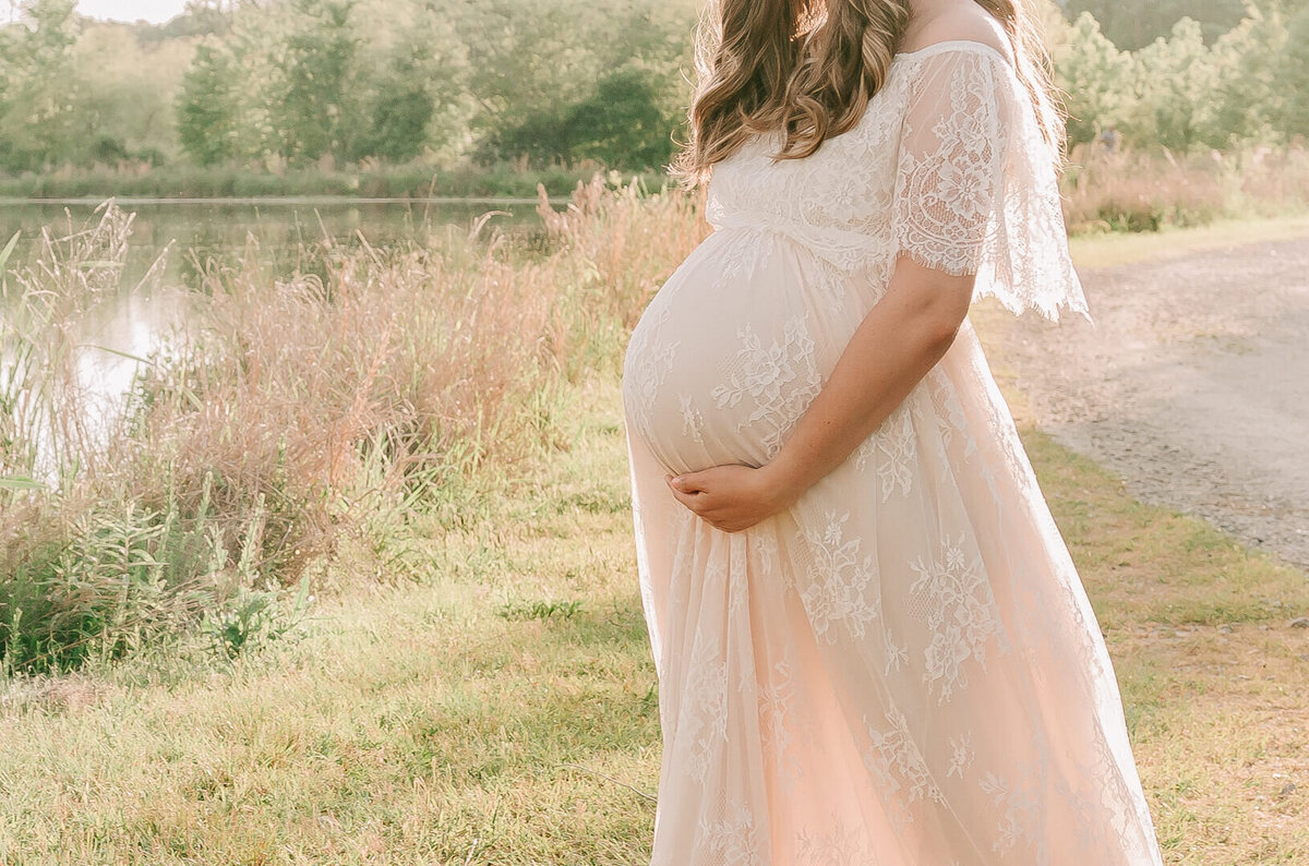 maternity photo session of a  pregnant woman wearing a gown