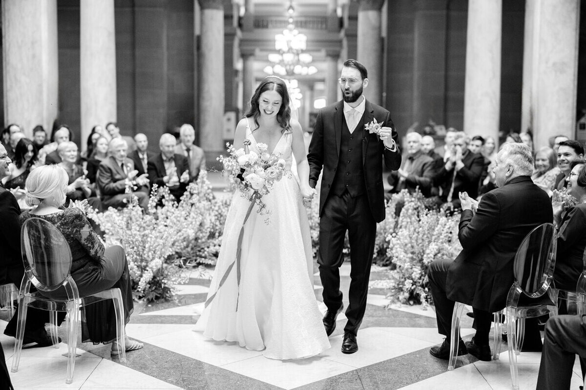 Bride and groom walking down aisle at wedding ceremony, taken by top wedding photographers in Cincinnati