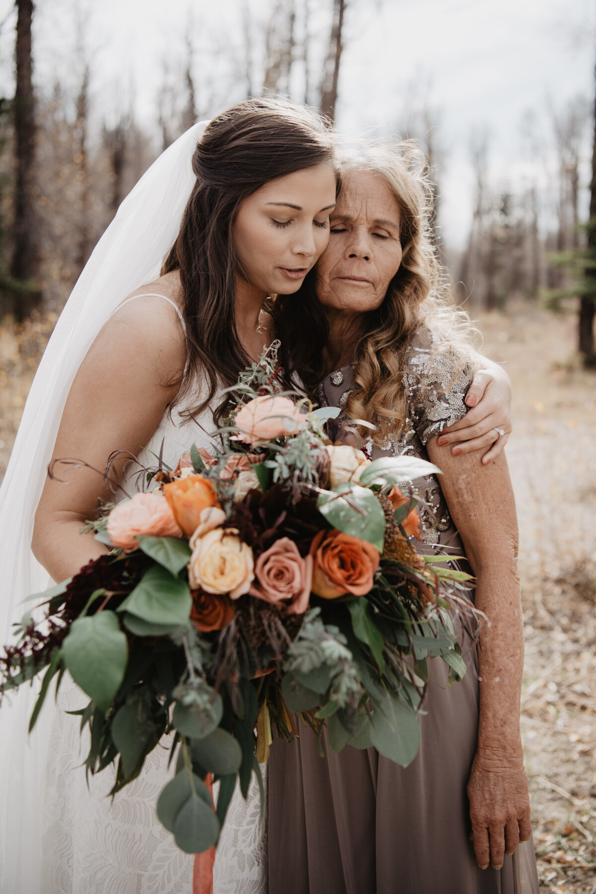 Photographers Jackson Hole capture bride hugging mother