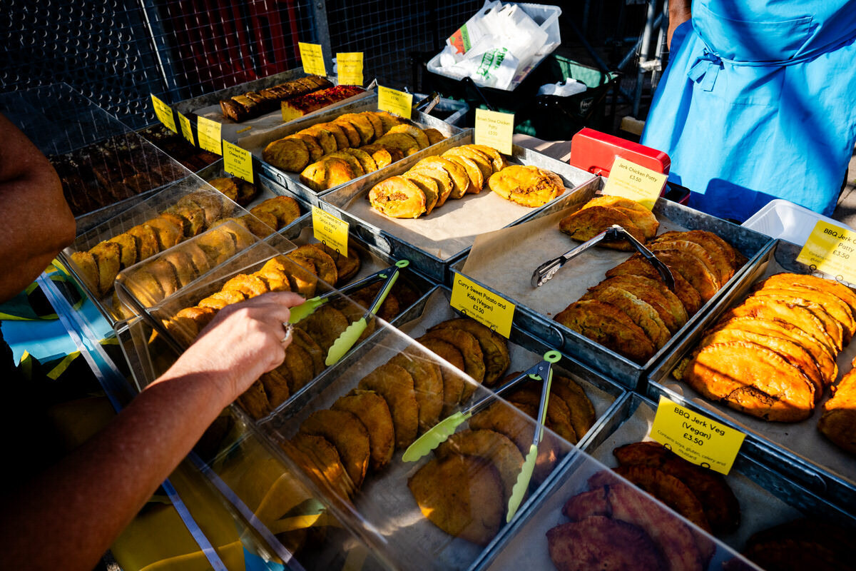 photography of a staffordhire oatcake with a side of brown sauce