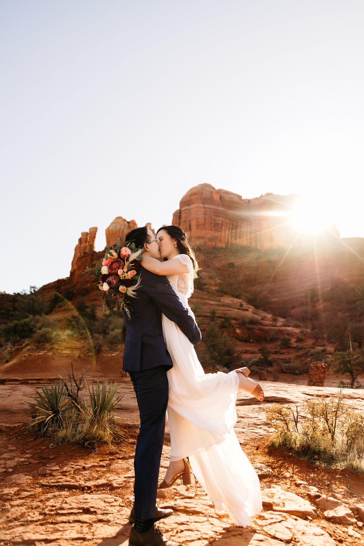 couple kissing during outdoor elopement day