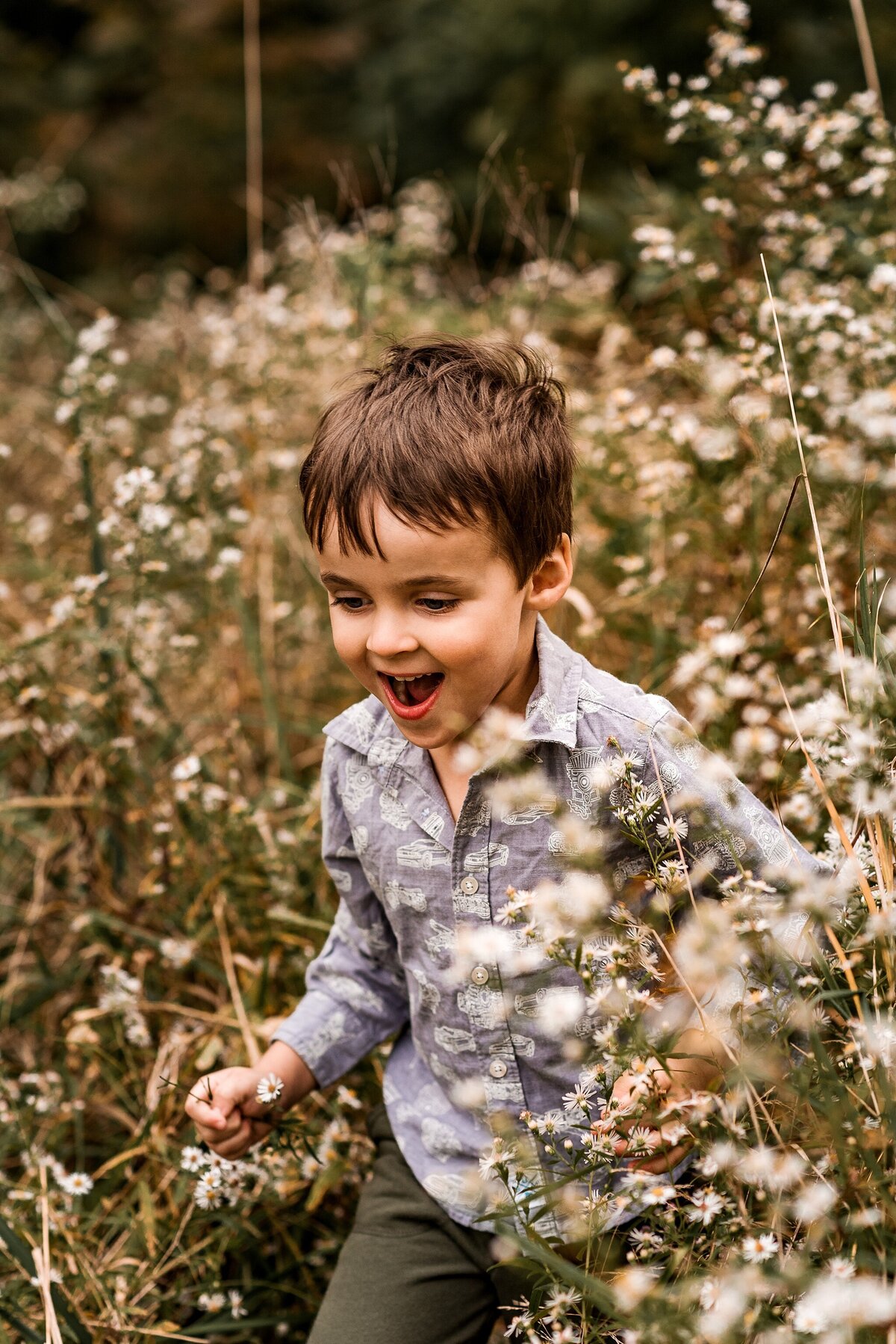 happy boy running in field