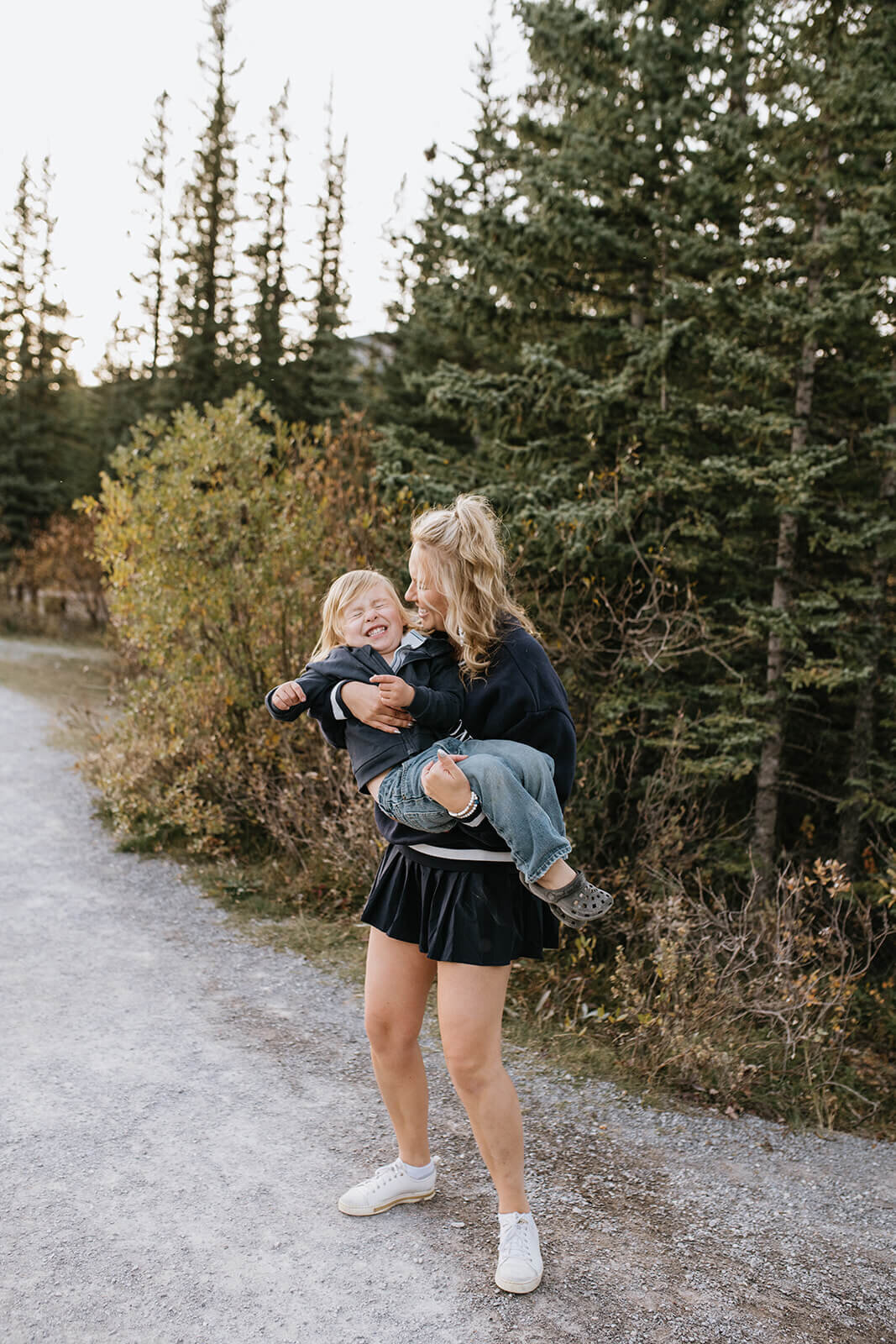 woman-holding-kid-laughing