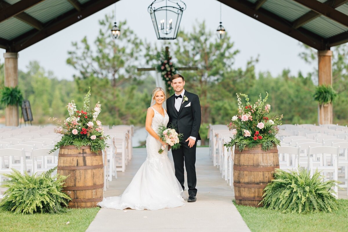 bride and groom standing at the entrance to their wedding ceremony
