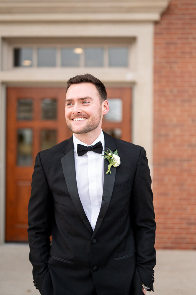 Groom smiling