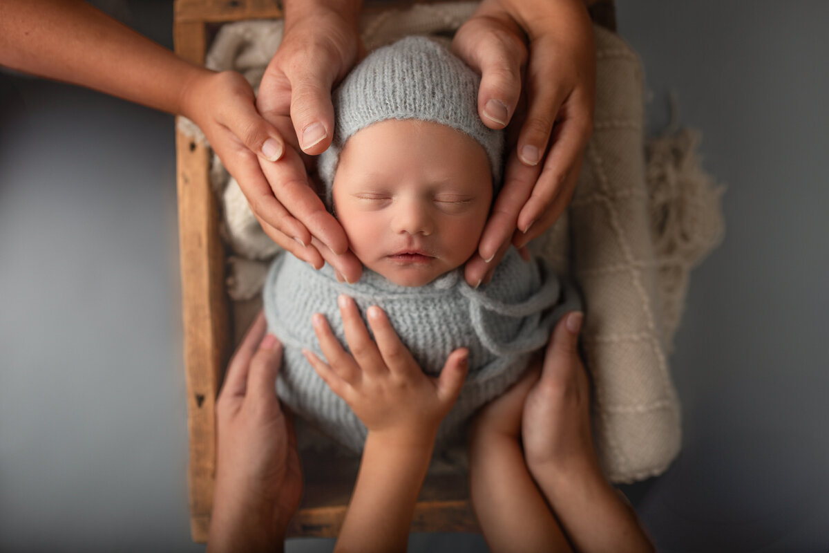 Family-holding newborn-studio photography
