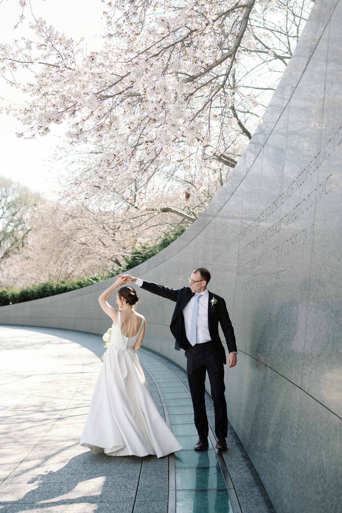 bride and groom at Washington DC MLK monument wedding with cherry blossoms