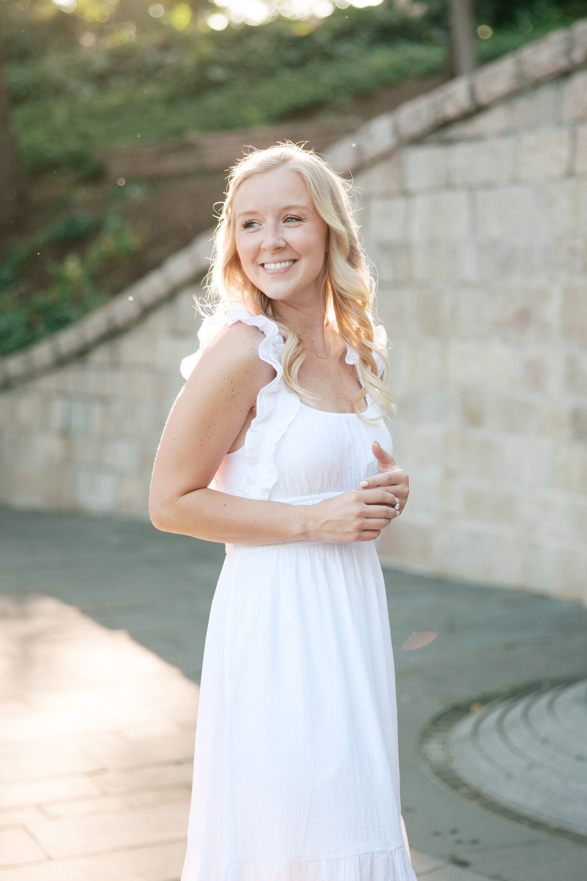 Bride-to-be smiles during golden hour at Columbus park, photographed by Philly wedding photographer.
