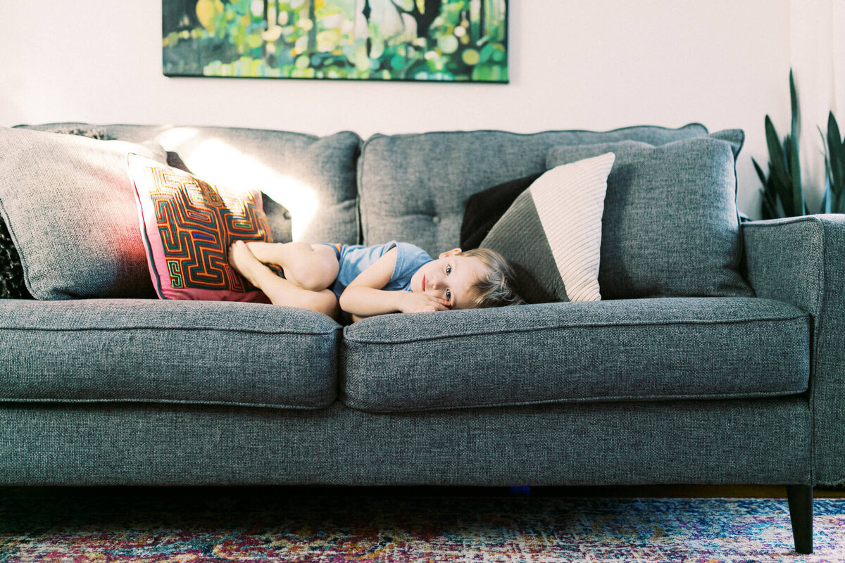 little boy on couch lifestyle photography
