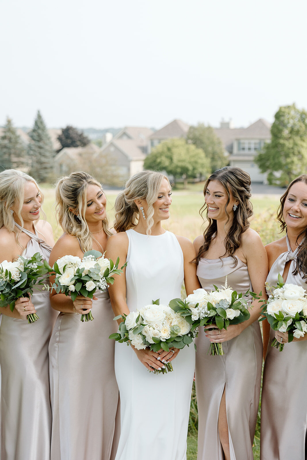 Bridal party with soft glam makeup and elegant hairstyles in Madison, WI.