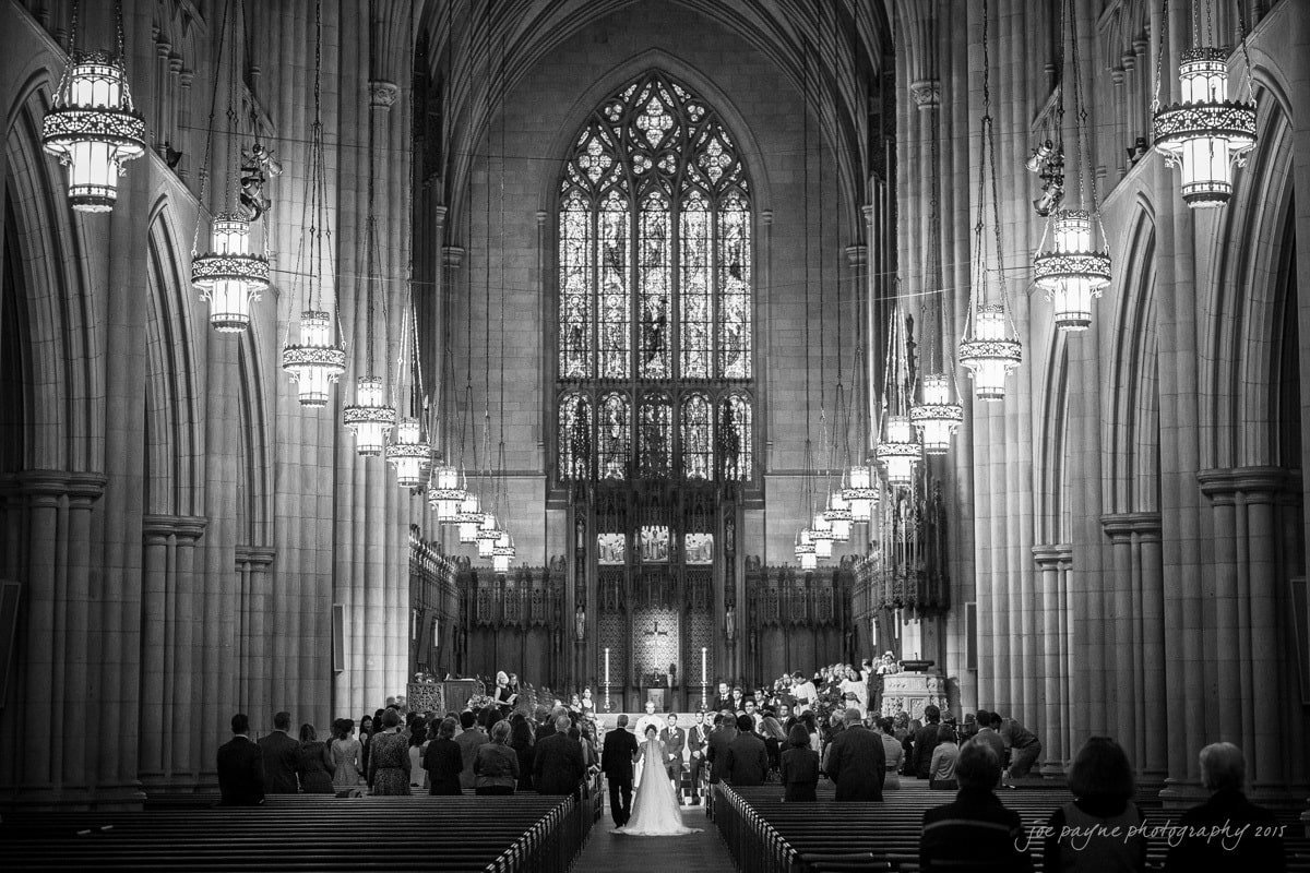 A bride and groom standing at the altar during their wedding.