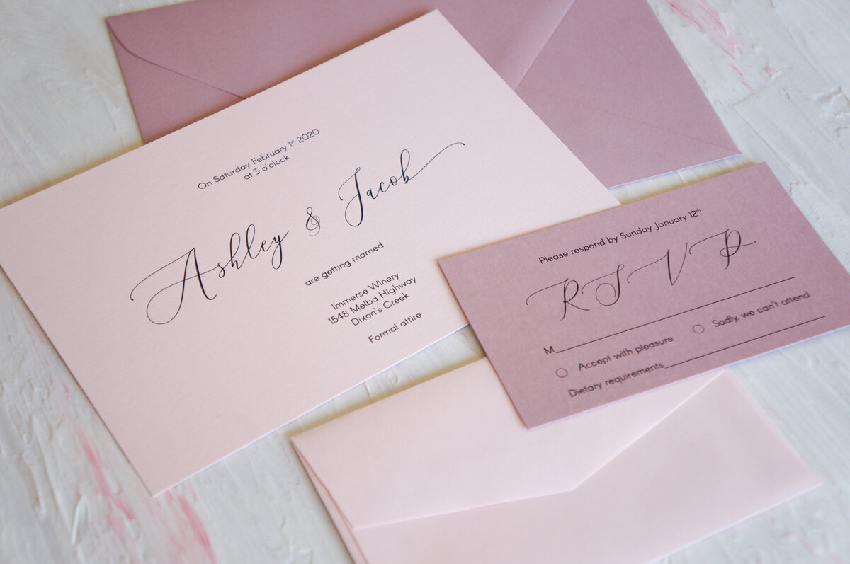 Rose pink wedding invitation with script cursive font