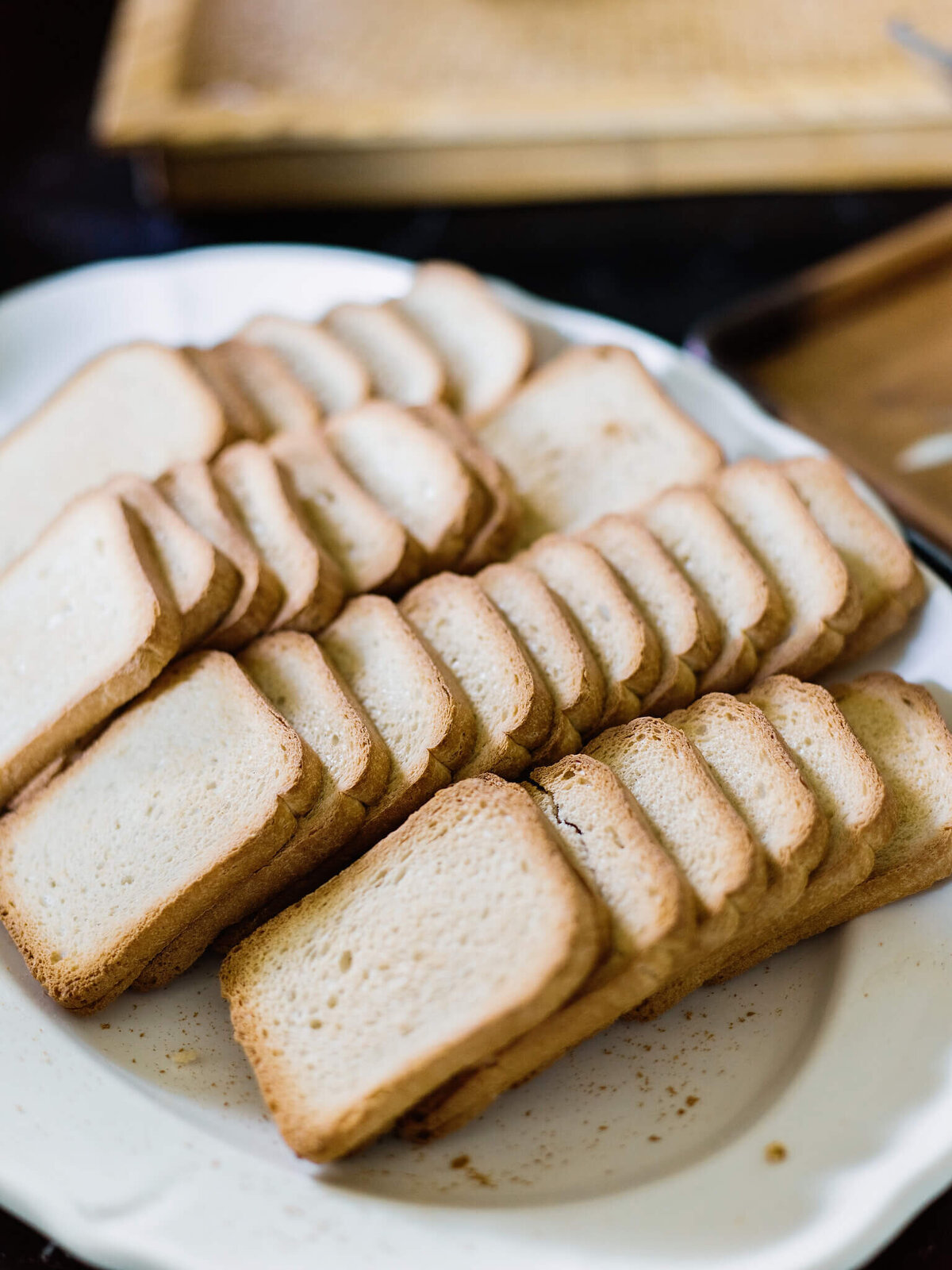 Lots of sliced bread on a large, round plate.