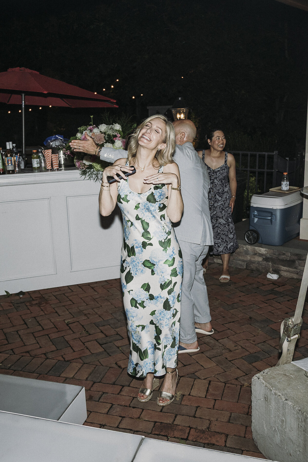 Photo of birthday host in private backyard party by Mira Park Photography NY based wedding photographer