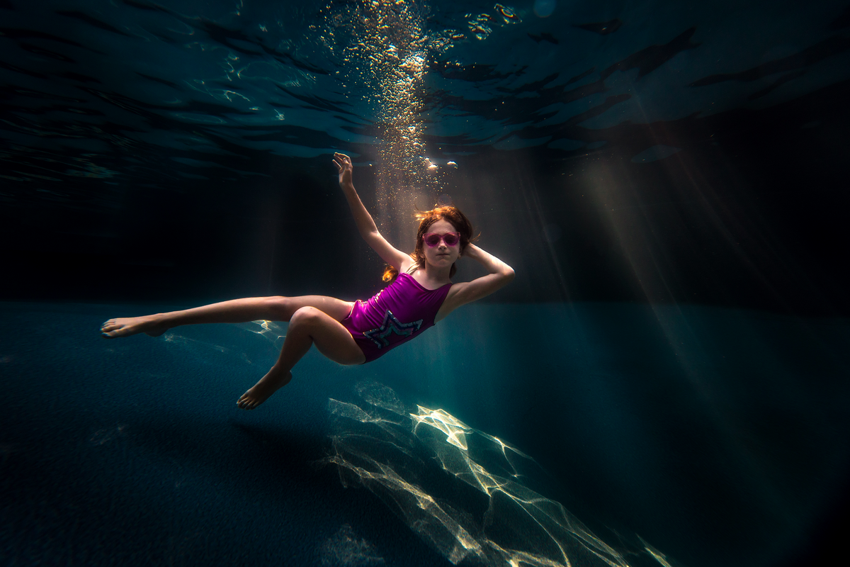 underwater photographer, columbus, ga, atlanta, pool, young girl swimming, sunrays, ker-fox photography_3769