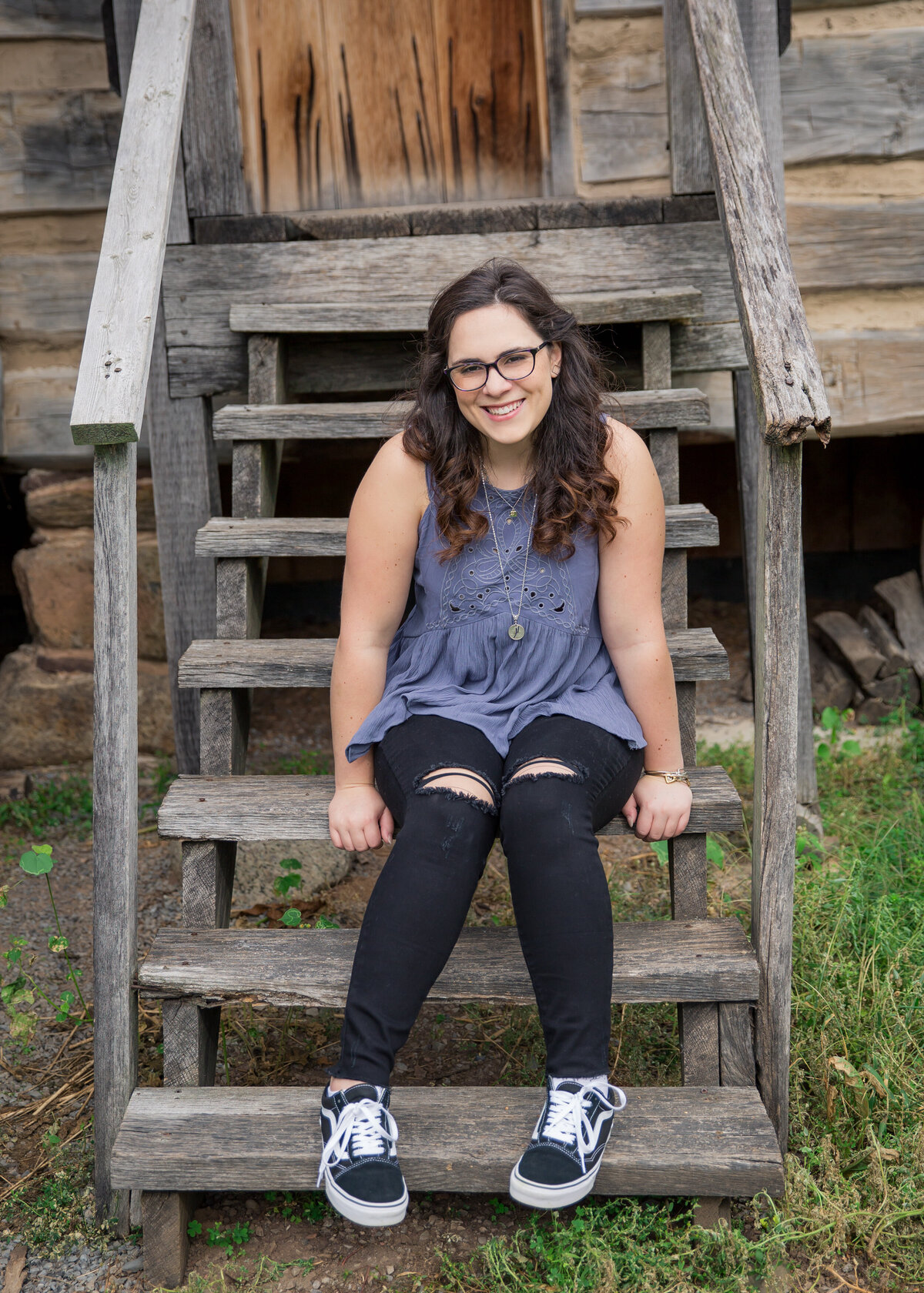 Senior girl sitting on wooden steps 