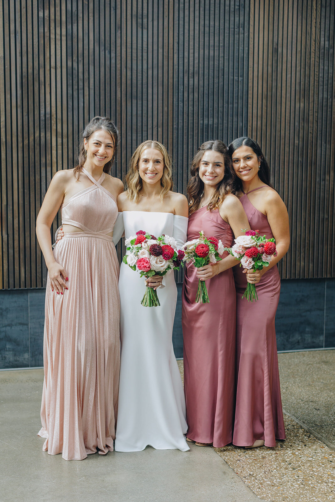 bride and her bridemaids with flowers