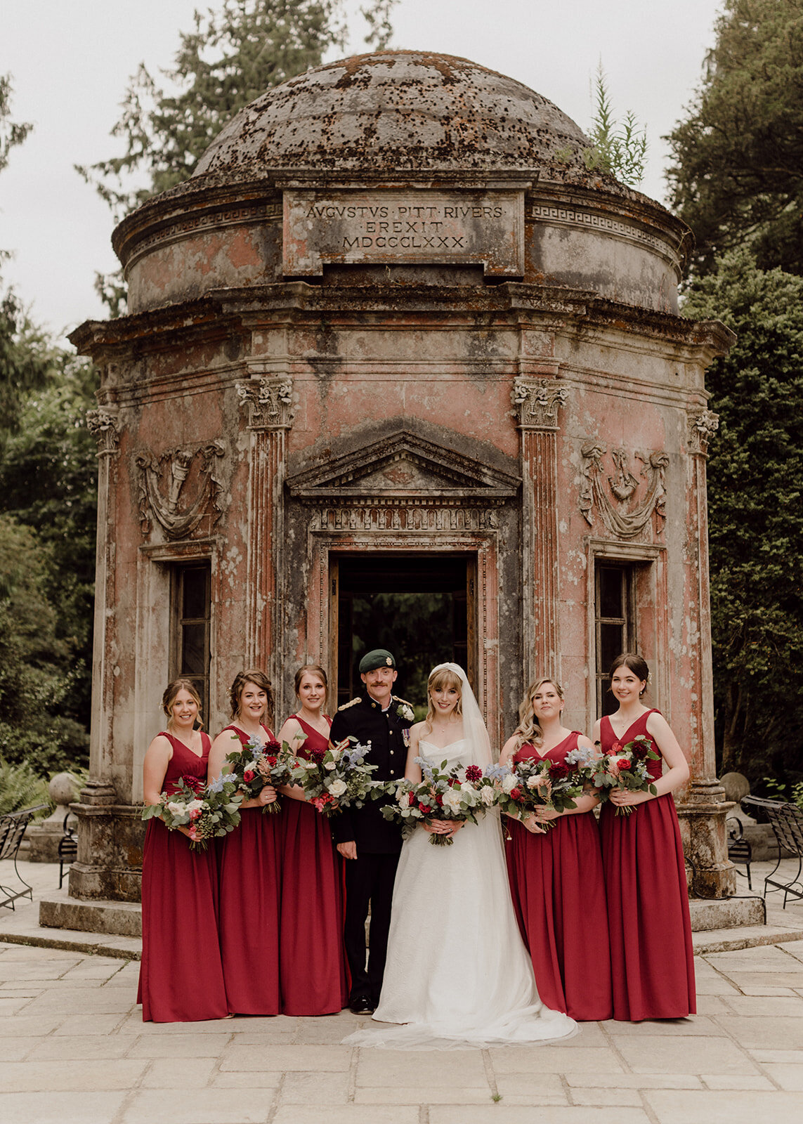 Bride with bridal party in red dresses
