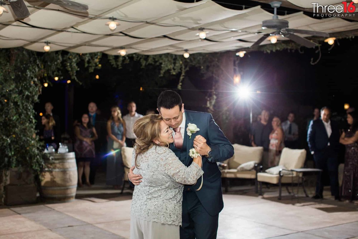 Groom dances with his mother