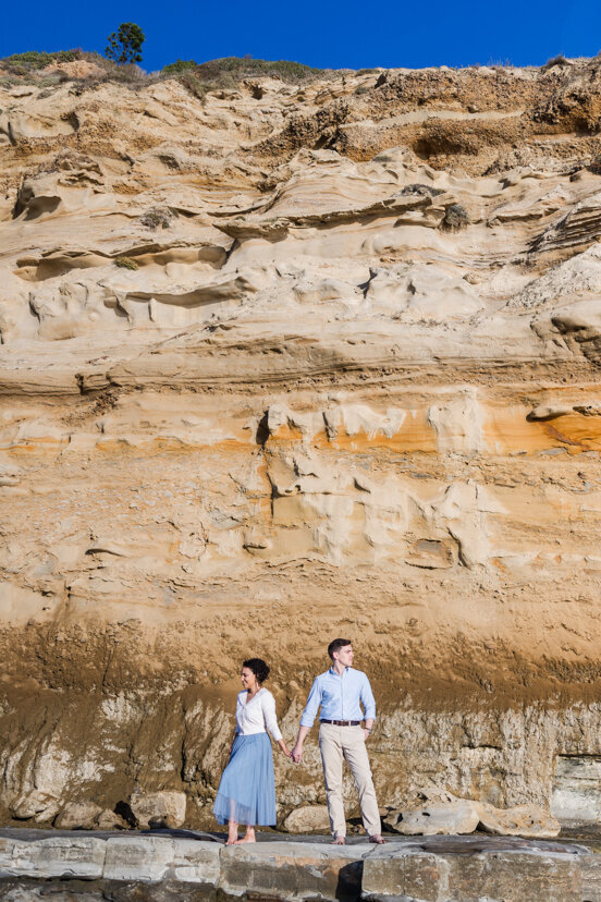 engaged-couple-by-cliffs-la-jolla-san-diego