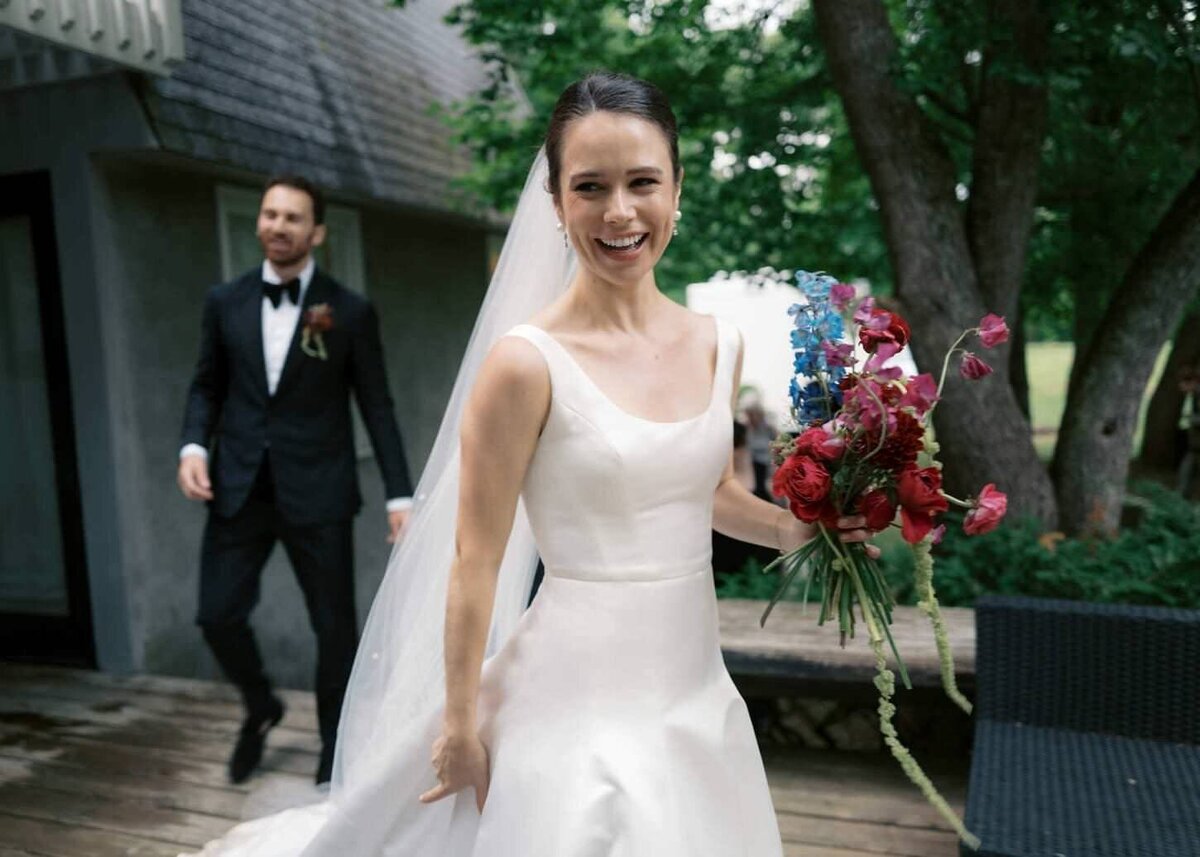 troutbeck-14-bride-smiling-as-she-walks-down-the-aisle-at-troutbeck-jenny-fu-studio