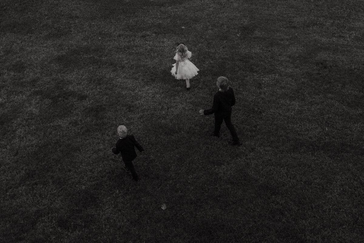 kids run around during wedding cocktail hour