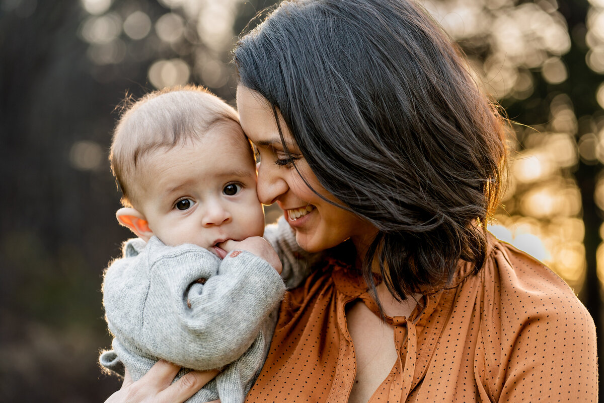 Mom snuggling against her little boy during golden hour in Sudbury MA