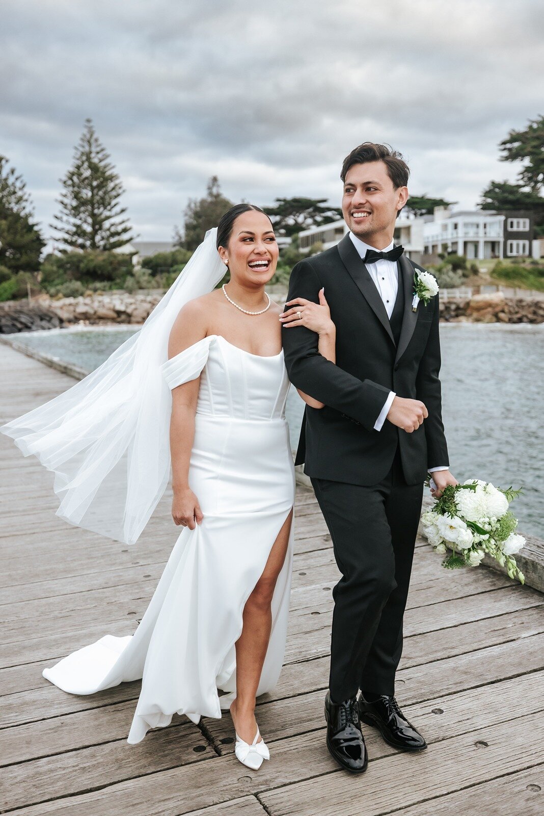 Bride and groom on the pier at Portsea Hotel