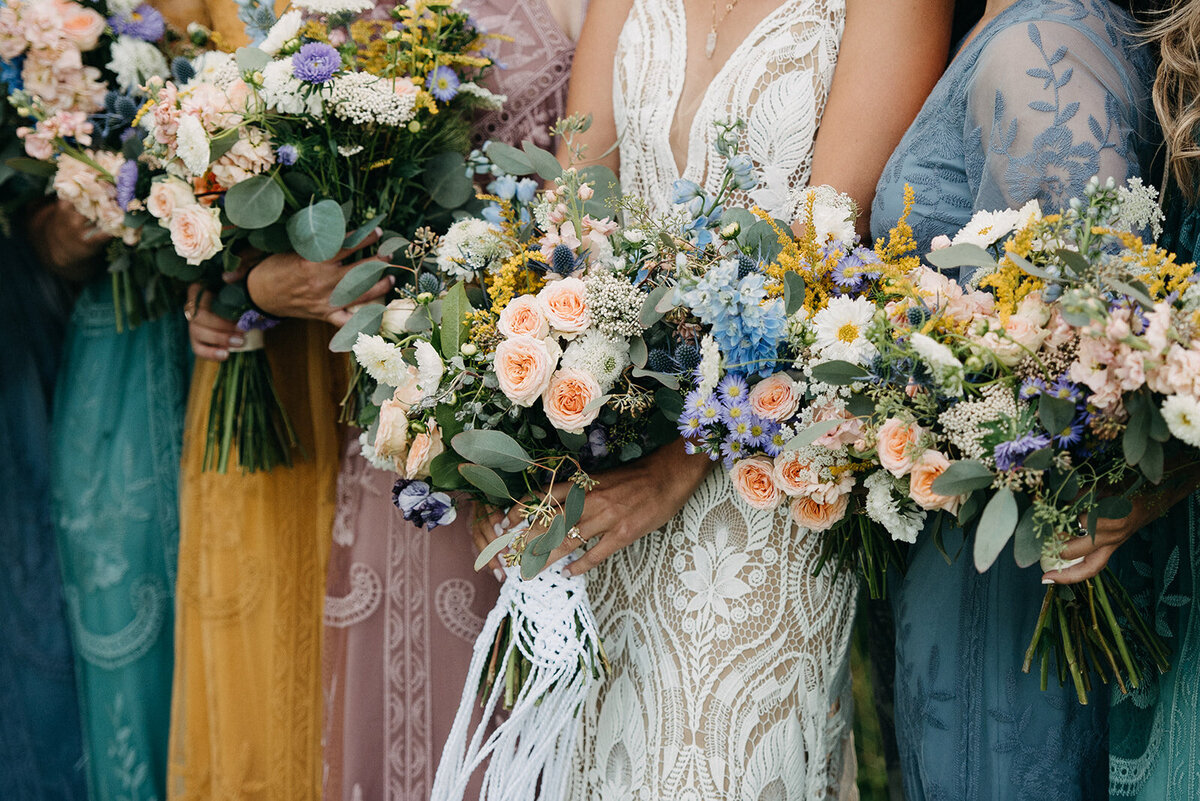 Multicoloured lace bridesmaids dresses, captured by Kristin Sarah Photography. Featured on the Bronte Bride Vendor Guide.