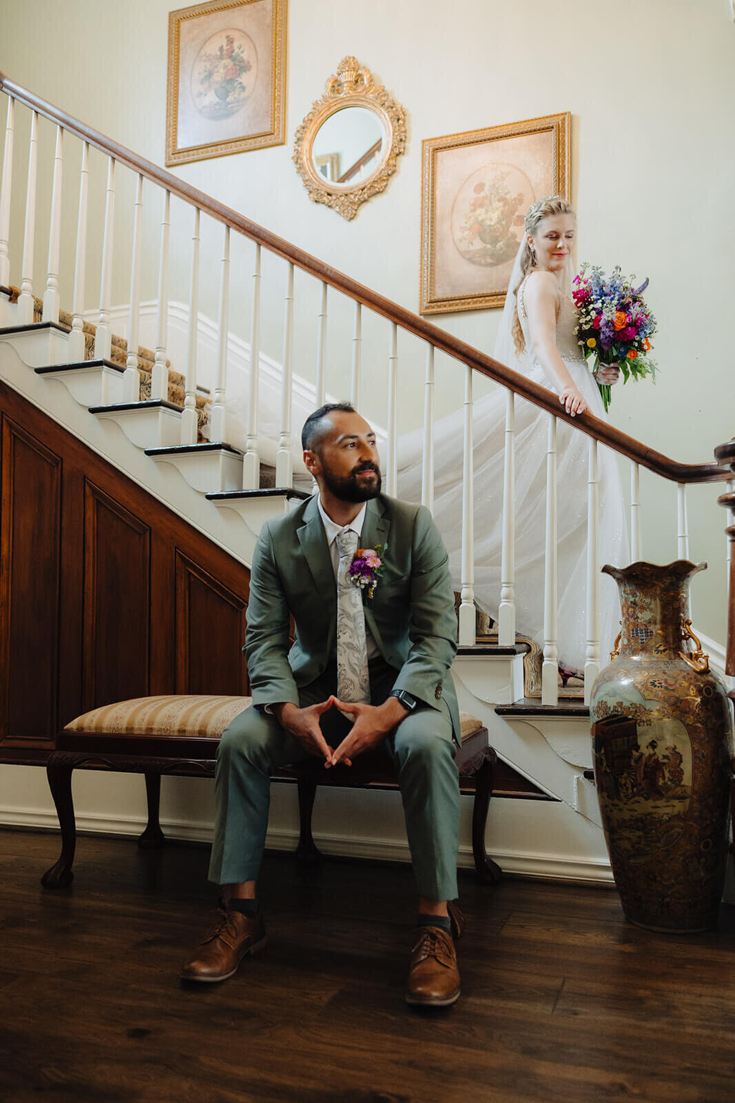 Groom sitting on bench before wedding at The Mansion at Keuka Lake, NY