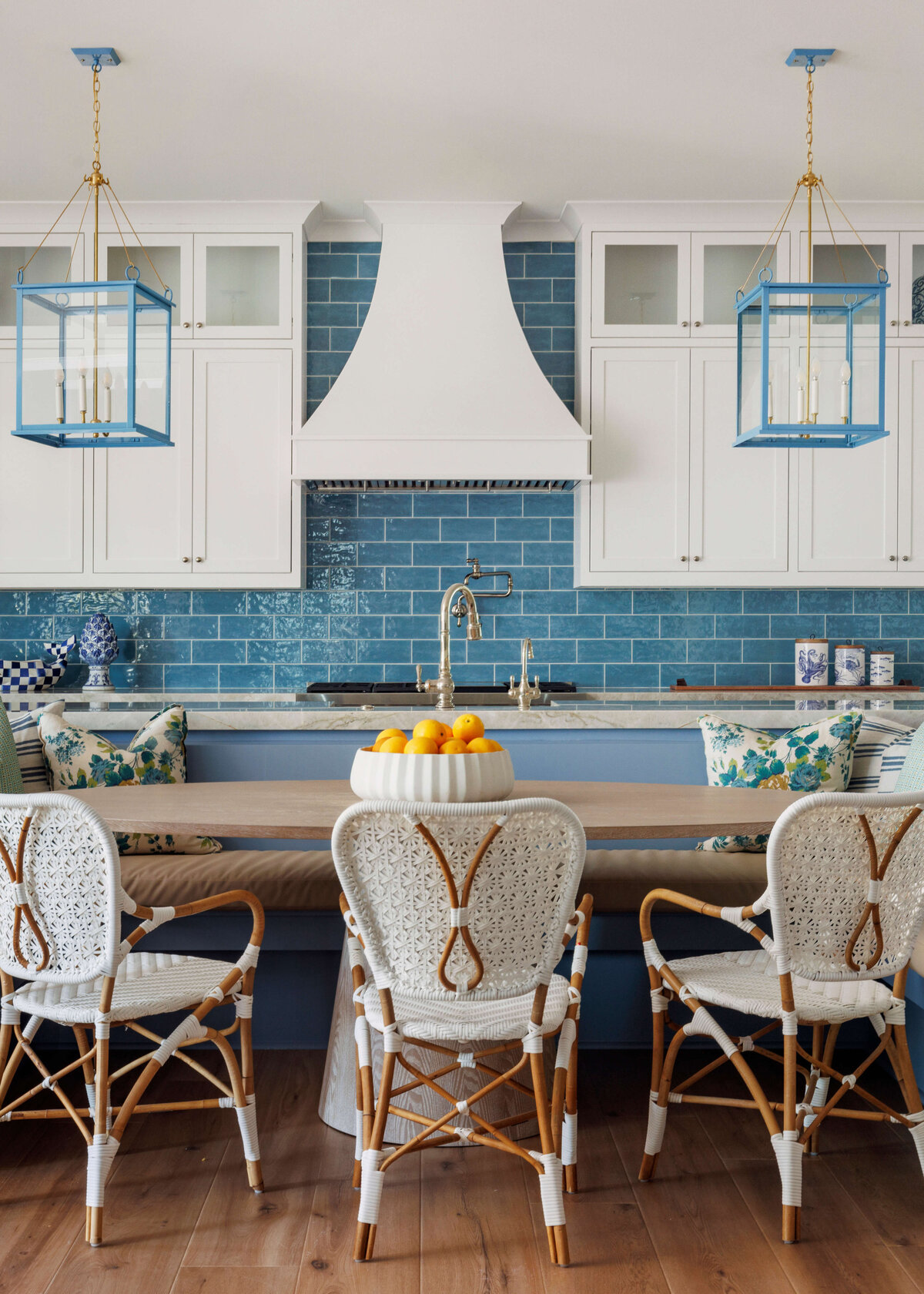 oyster creek studios lighthouse on the lake white wicker chairs with brown table with turquoise tiles in kitchen