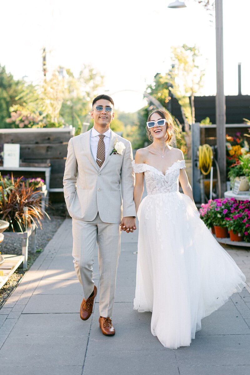 bride and groom walking through terrain gardens
