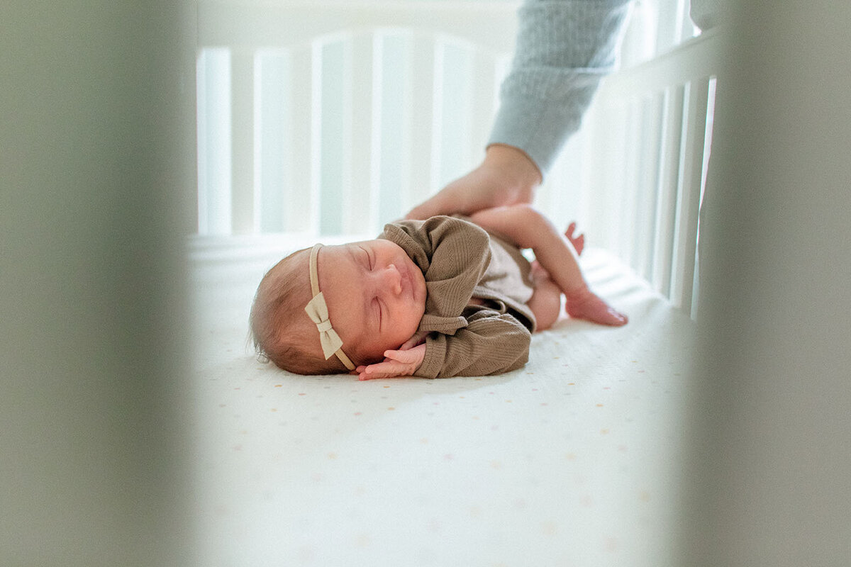 Peaceful newborn sleeping in crib - Sara James San Antonio newborn photographer creates serene nursery portraits and delicate baby imagery during quiet lifestyle sessions in Texas family homes
