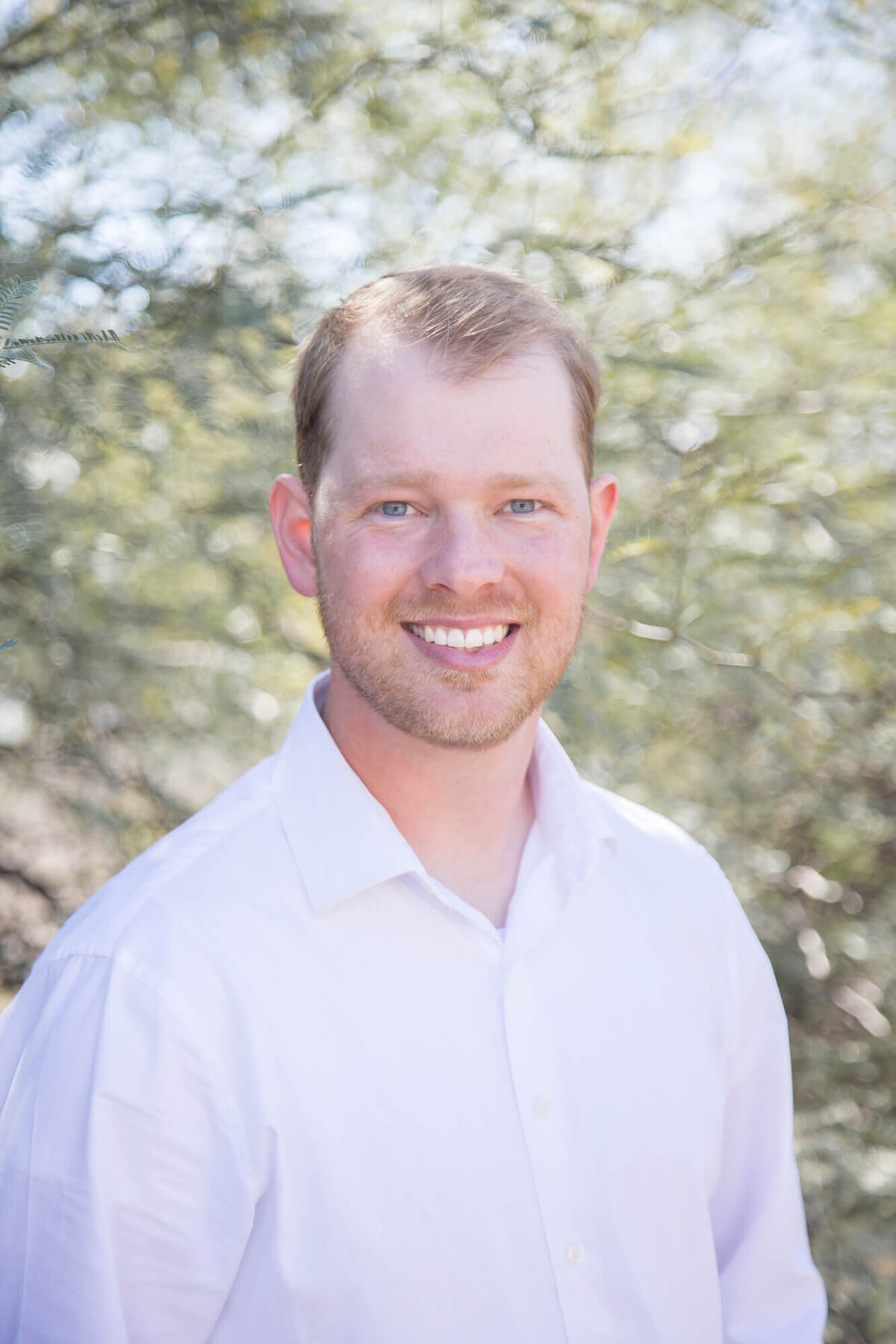 blonde man in a white shirt in desert park  near Mesa, Arizona