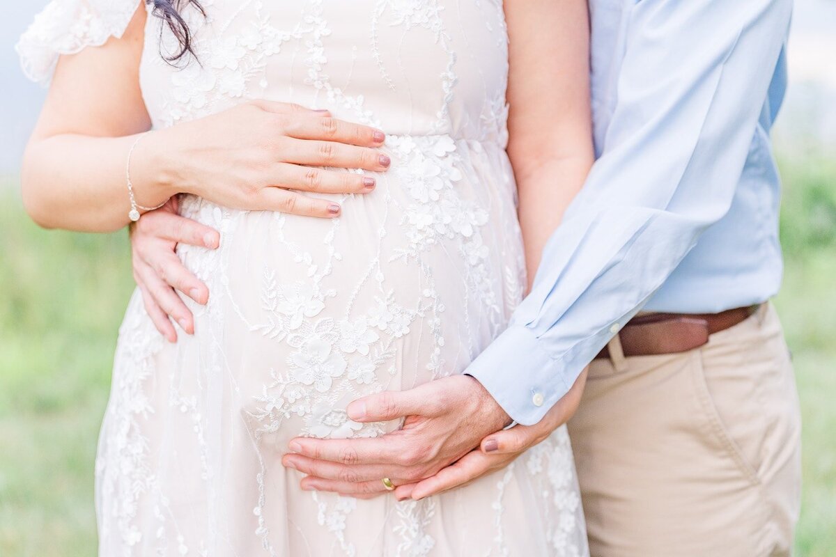 expecting couple hugging mom's belly taken by a maternity photographer in Northern Virginia