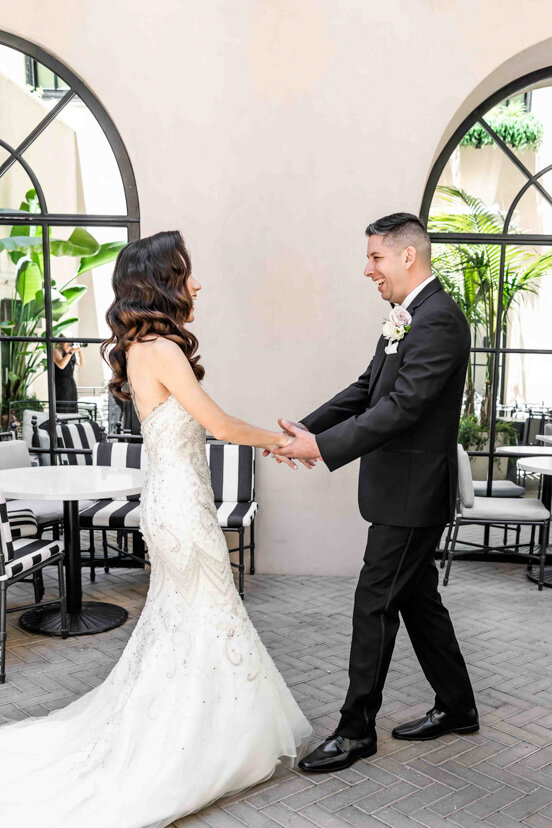 bride-and-groom-first-look-couryard-at-the-guild-hotel-san-diego-wedding