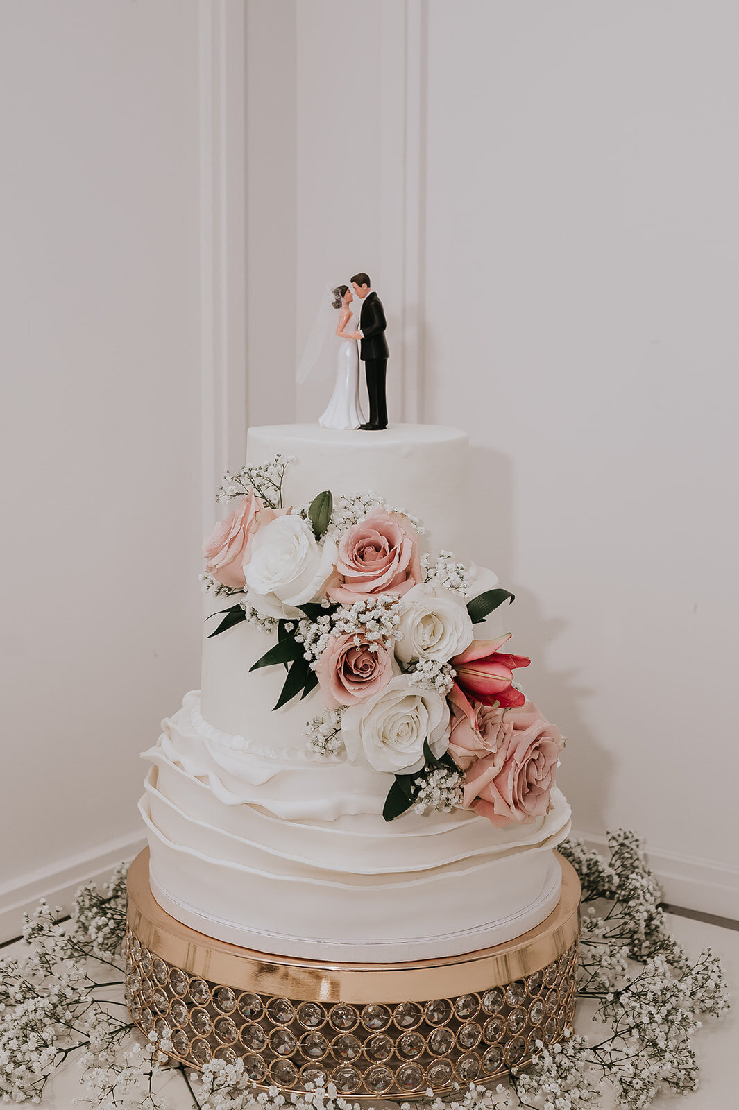 white, pink, and green wedding cake