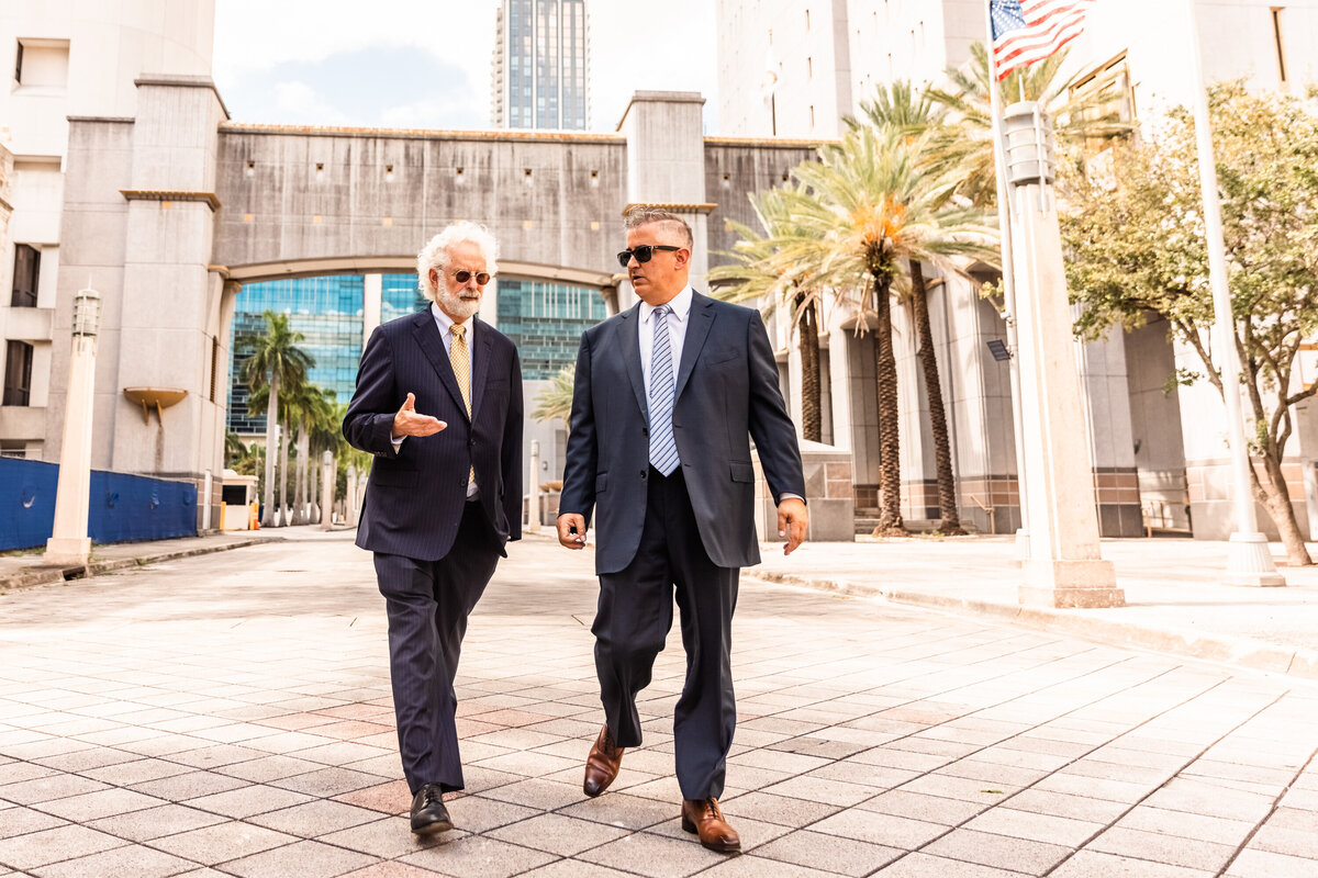 two men walking down street