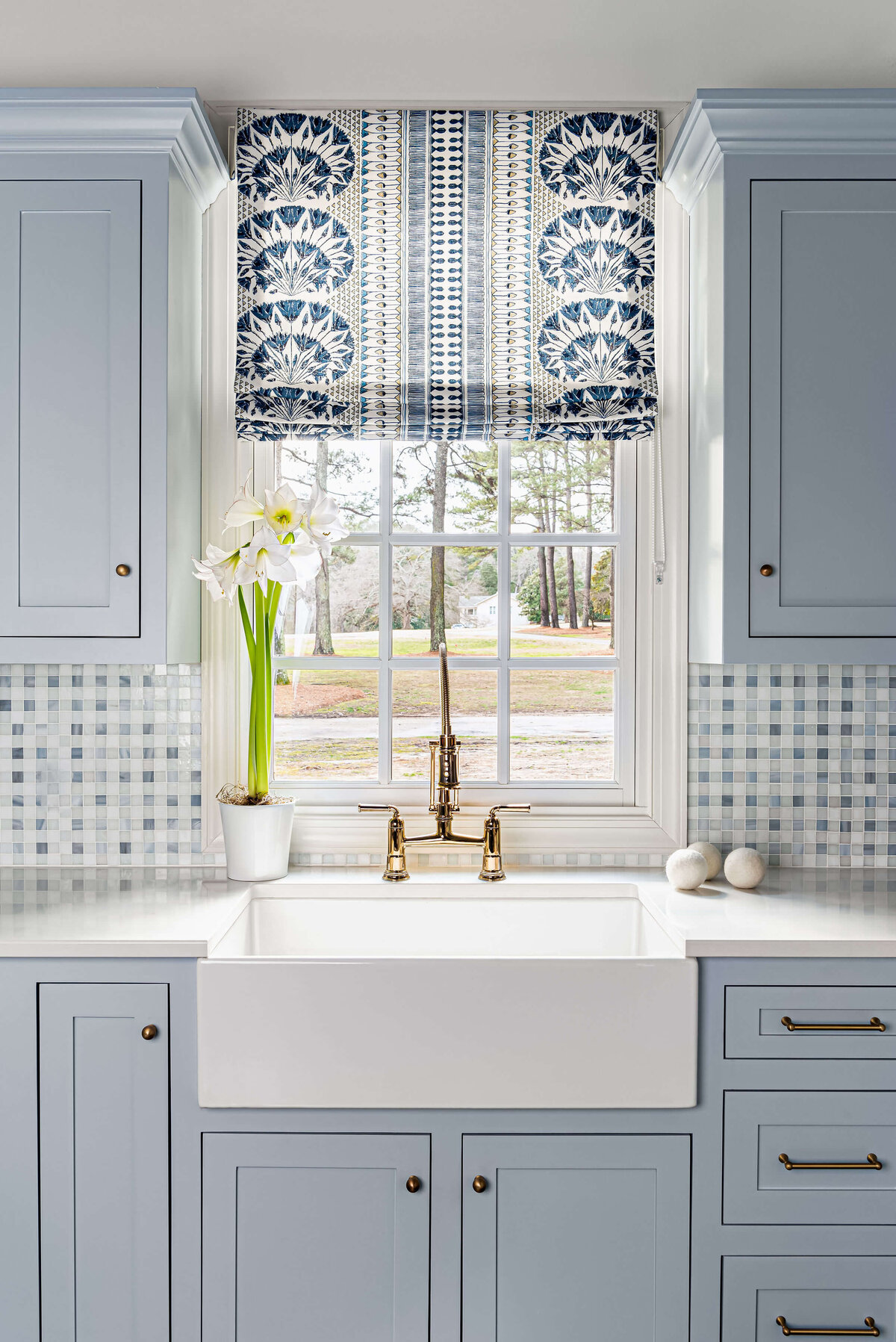 sweet southern home windmill farm sink in light blue laundry room