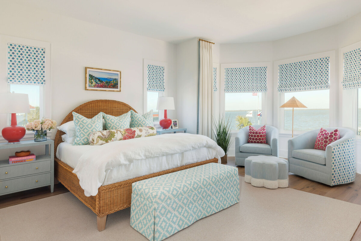 oyster creek studios lighthouse on the lake white bed with light blue pillows and gray side tables in bedroom
