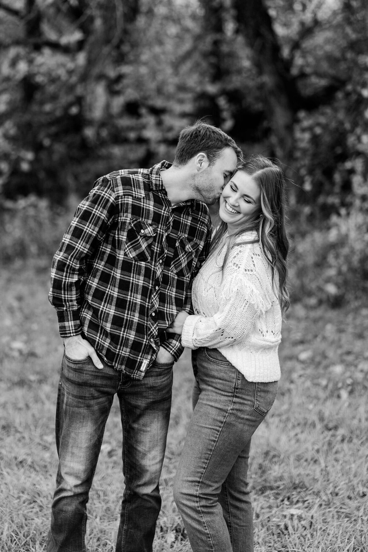 man-kissing-woman-cheek-engagement