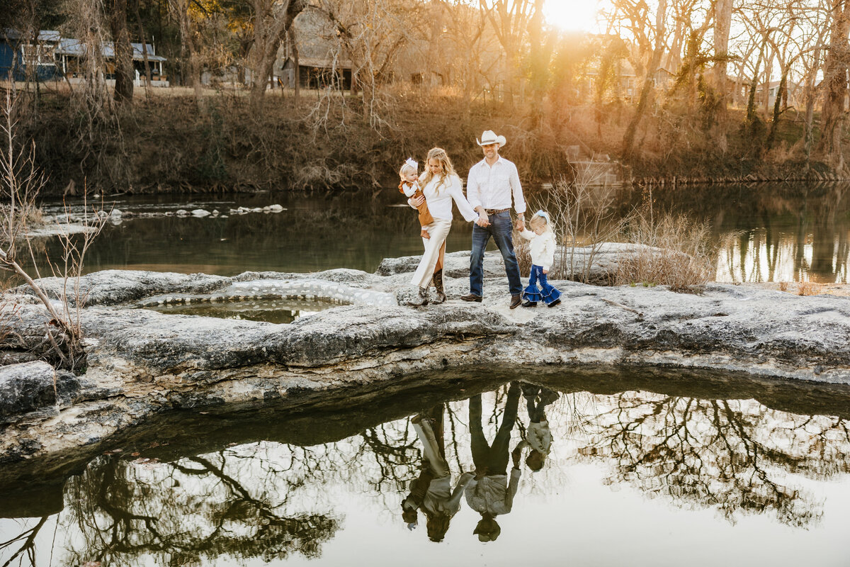 family-walks-around-riverbed