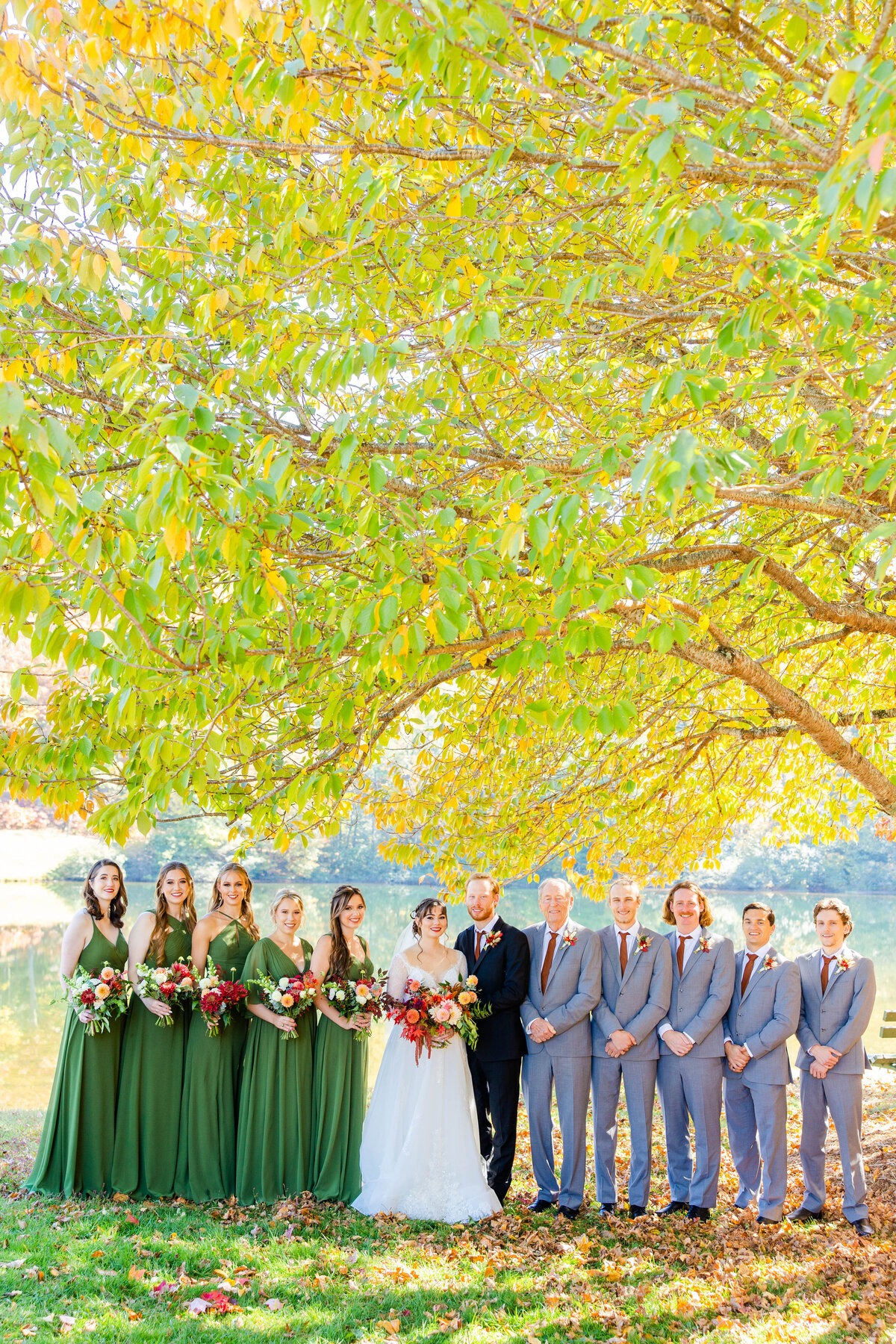 happy couple and bridal party at kenmure country club wedding