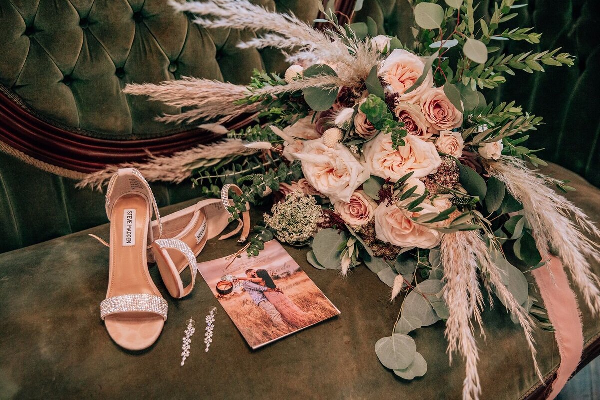 bridal details with her shoes, invites, and bouquet
