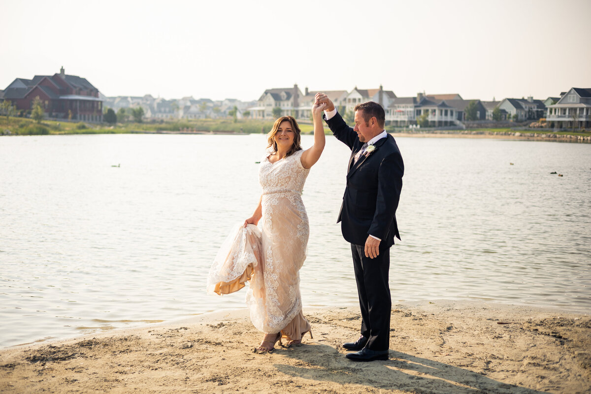 Bride and groom twirling fun happy emotional photos