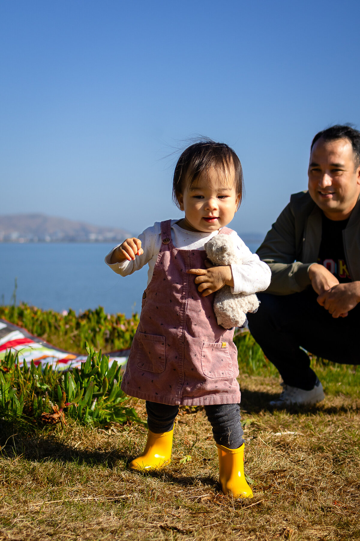 joyful father and girl daughter toddler bonding by the San Francisco Bay – natural light family photography by Ellobelle Photography, San Francisco Peninsula Bay Trail Burlingame