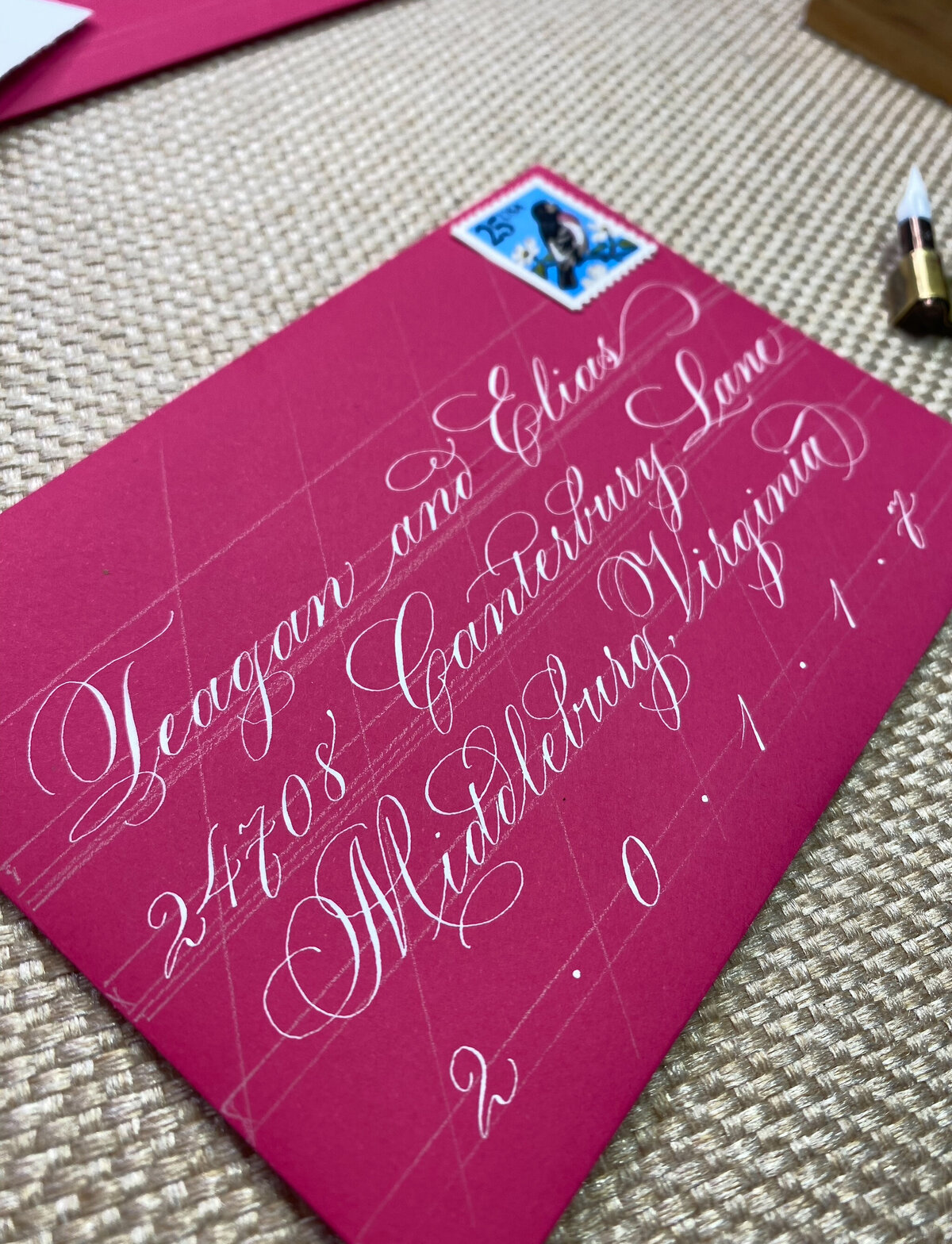 Elegant custom calligraphy on a pink envelope