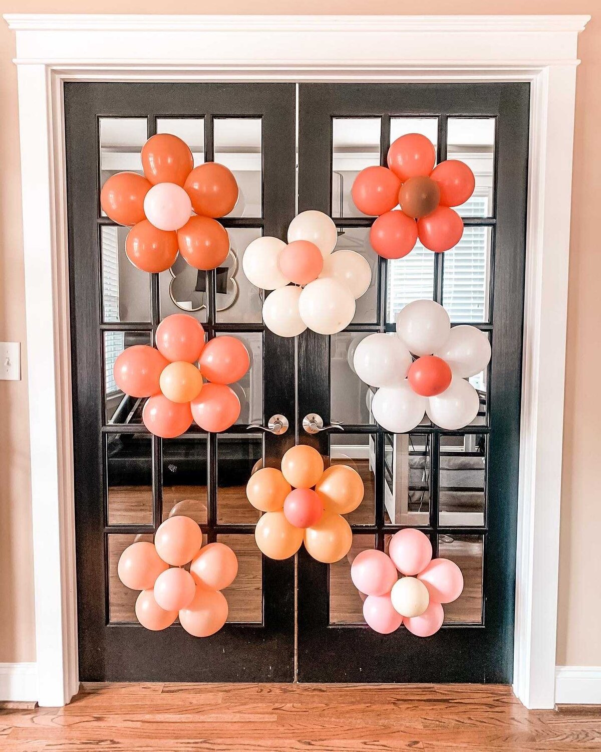 Flower balloons on door for birthday party